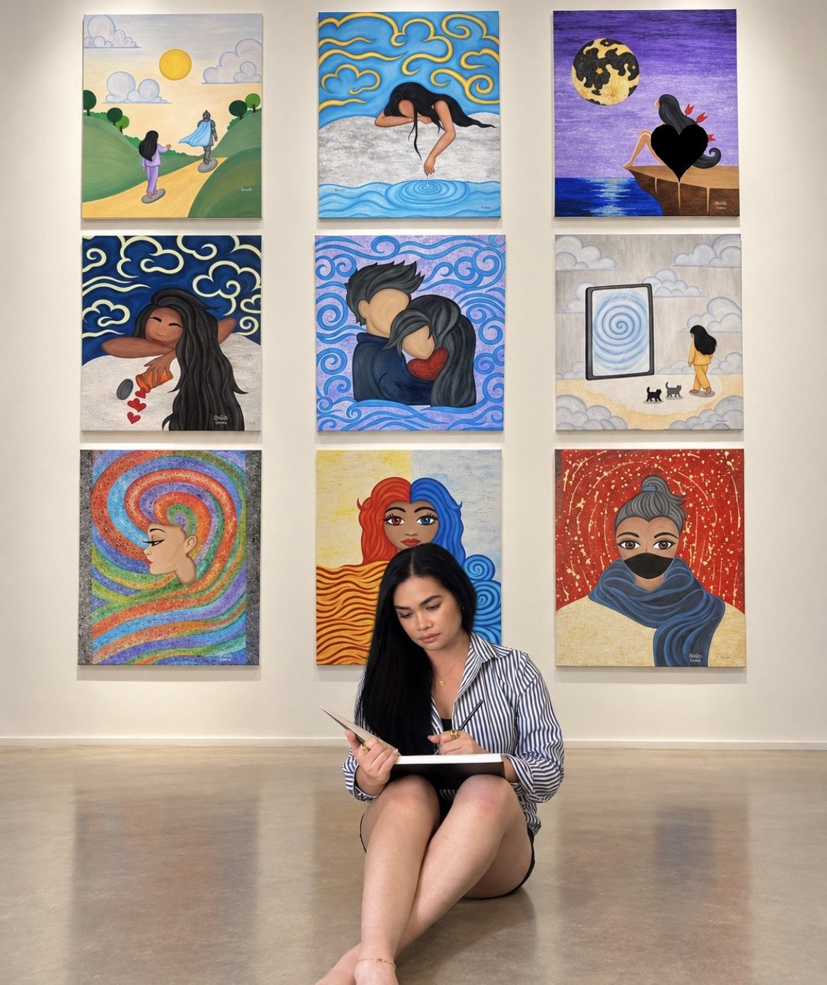 Karena writing before her Collection 2 wall of paintings