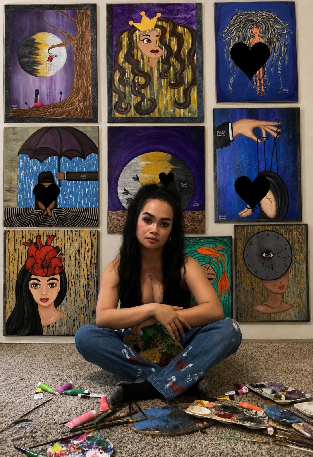 Karena Dolera sitting before her wall of paintings